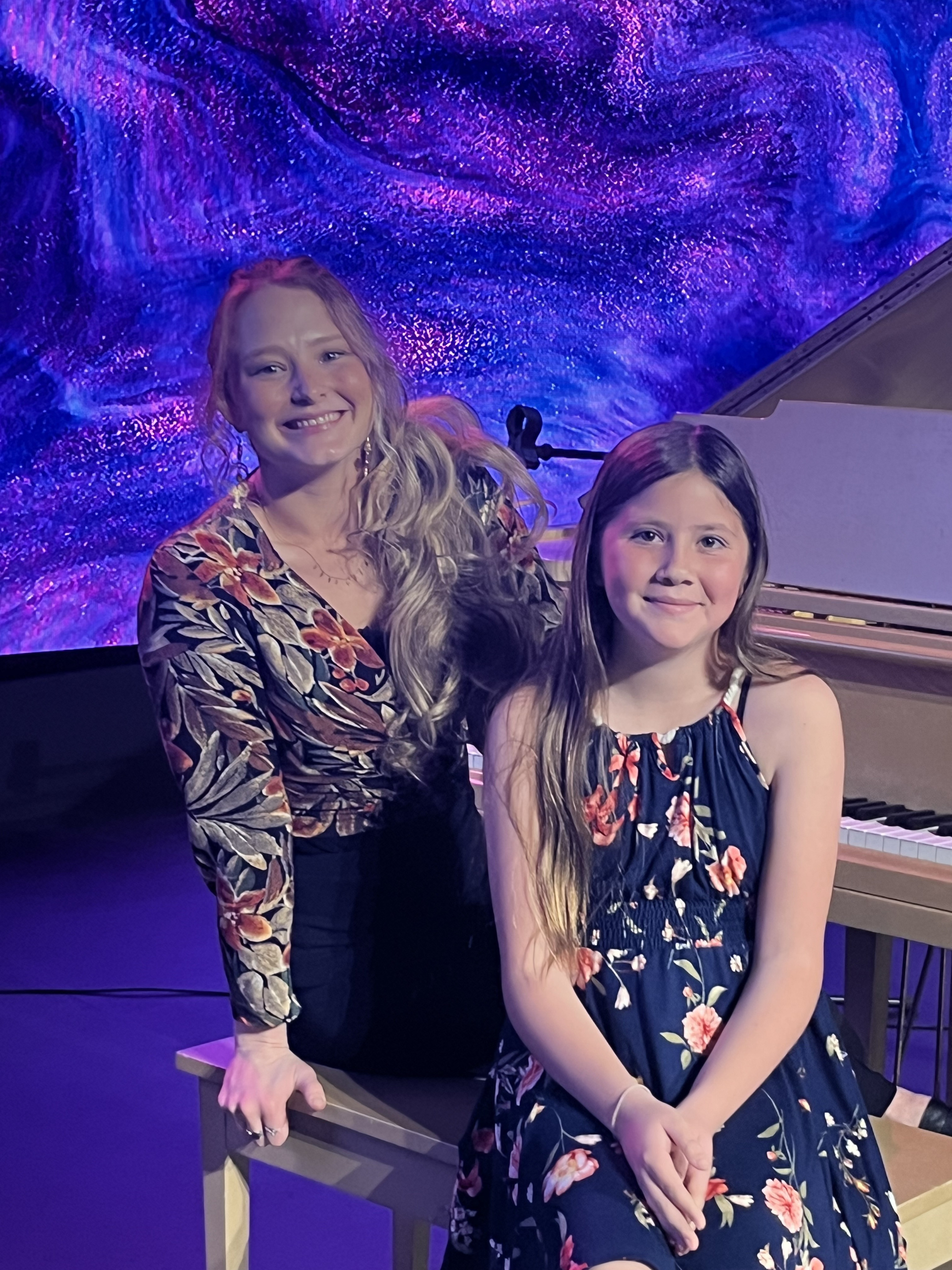 Danielle and a student smiling at the recital