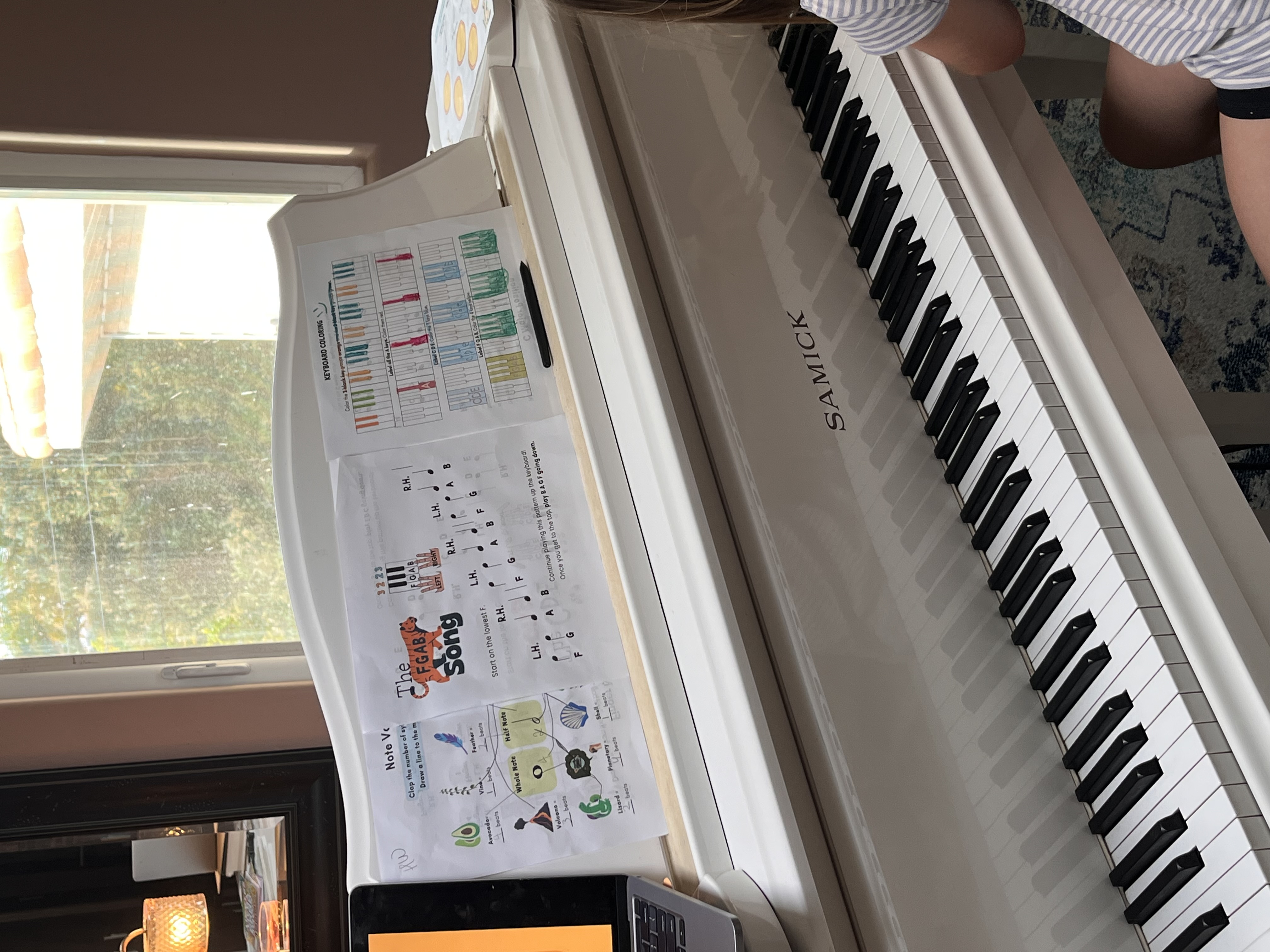 White Samick baby grand piano in the studio